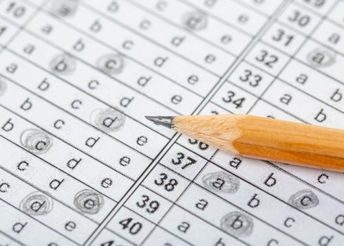 testing in exercise and exam paper. computer sheet with pencil in school test room, education concept